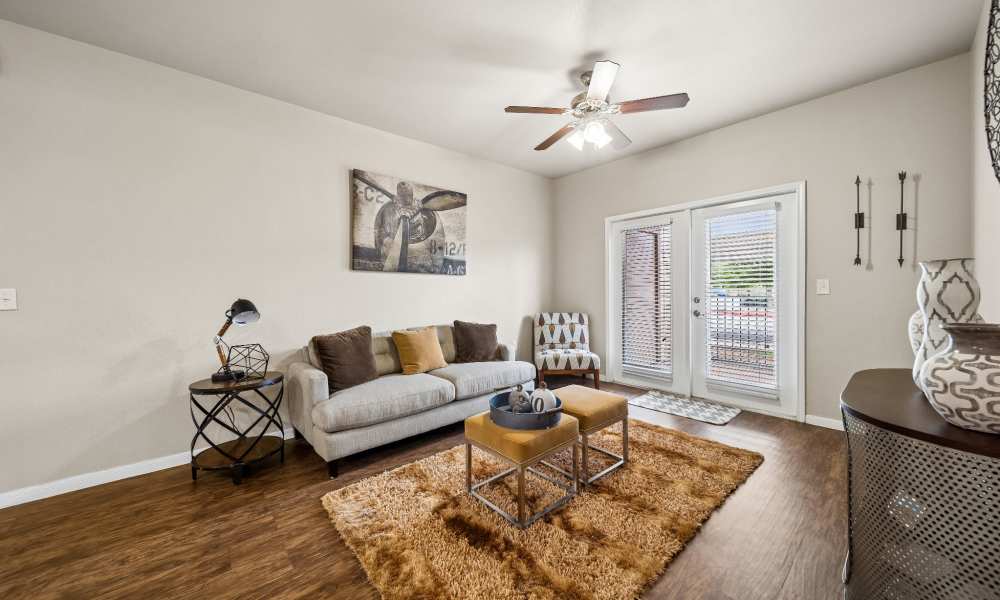 Living room with sliding glass door at Vistas at Red Creek in San Angelo, Texas