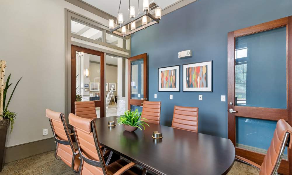View of conference room area with table and chairs at Plantation Park Apartments in Lake Jackson, Texas