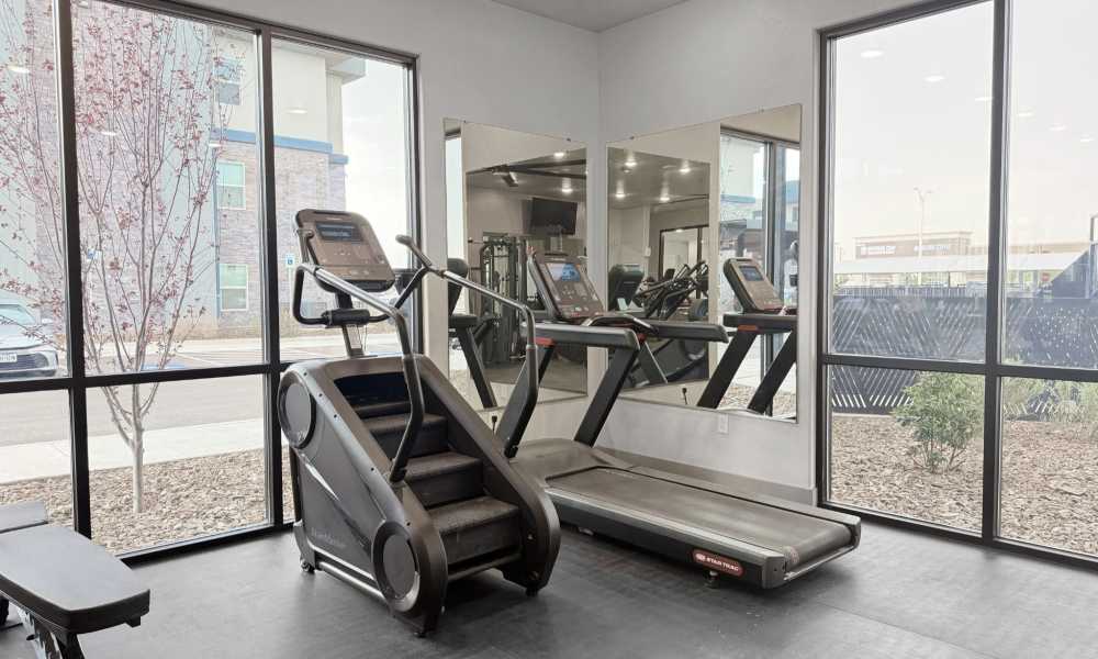 Stair climber and treadmill in corner at fitness center at Retreat at Eastlake in El Paso, Texas