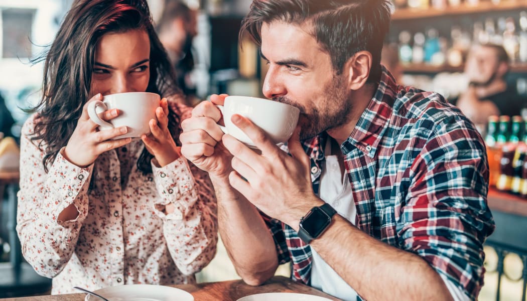 Couple enjoying coffee together in Tulsa, Oklahoma near Cedar Ridge