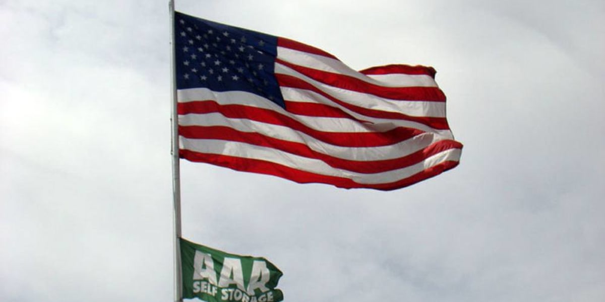 flying american flag at AAA Self Storage at W Market St in Greensboro, North Carolina