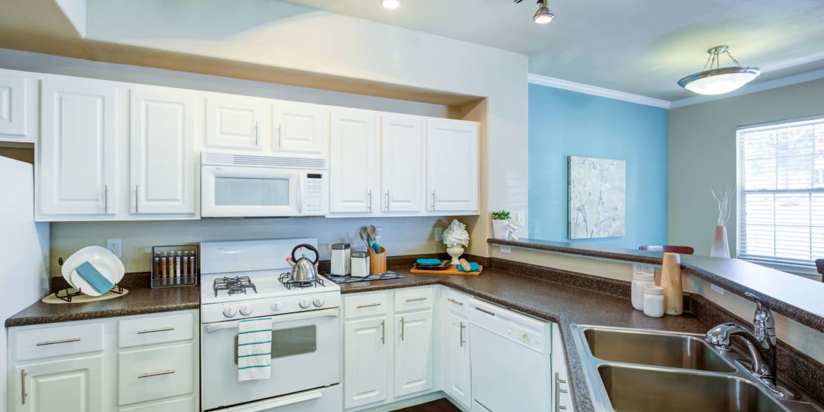 Very spacious kitchen with all white cabinets at Resort at University Park in Colorado Springs, Colorado