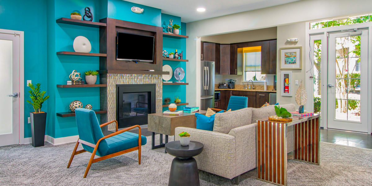 Clubhouse seating area with a TV at The Reserve at Ballenger Creek Apartments in Frederick ,Maryland