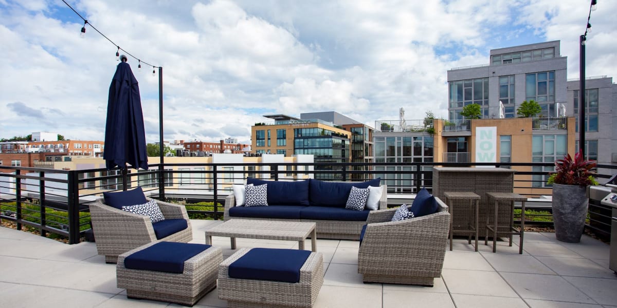 Lounge area outdoors with cozy chairs to relax in at 1350 Florida in Washington, District of Columbia