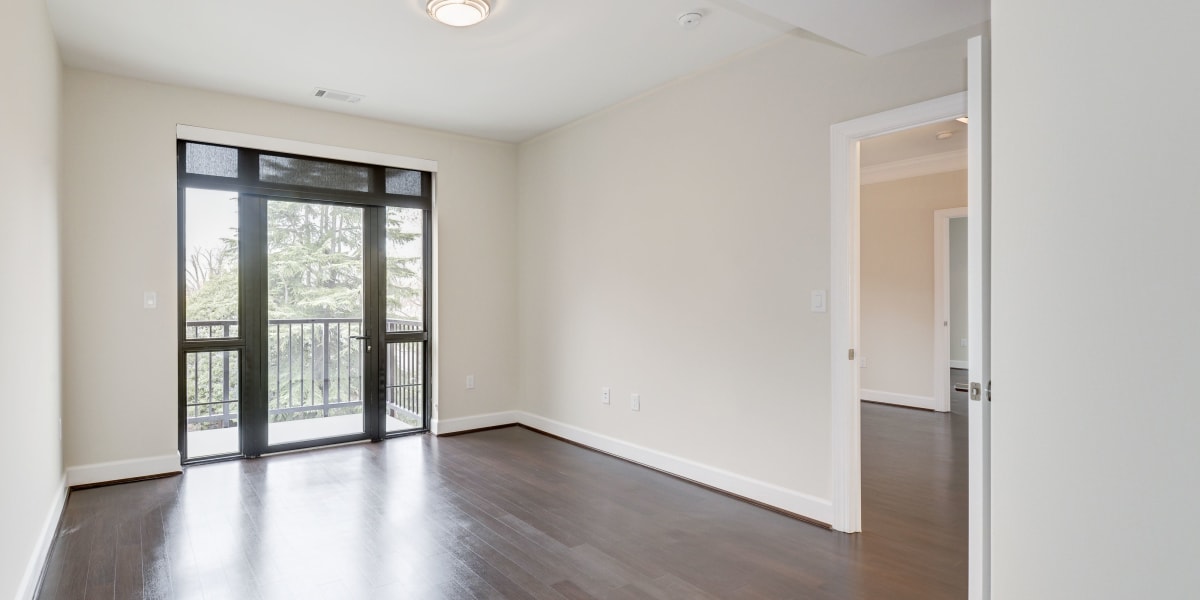 Living area with large windows and a door going to the patio at 700 Constitution in Washington, District of Columbia