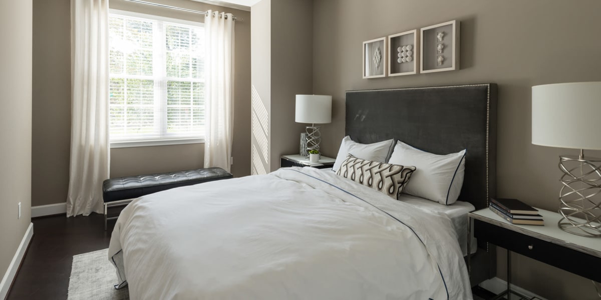 Furnished and well lit bedroom in a model home at 700 Constitution in Washington, District of Columbia