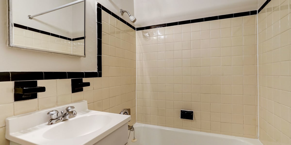 Cute bathroom with tile walls at Dorchester House in Washington, District of Columbia