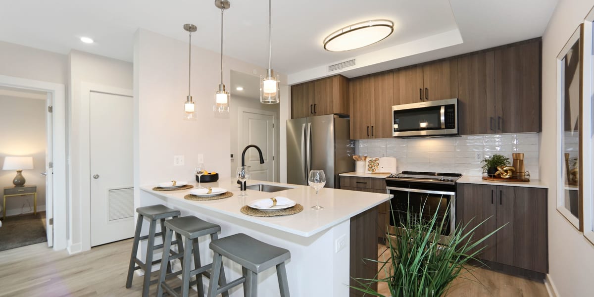Large island in the kitchen for lots of extra counter space at Madrona Apartments in Washington, District of Columbia