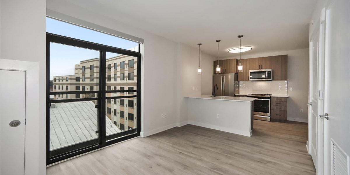 Lots of space in the living area and a large window with an amazing view at Madrona Apartments in Washington, District of Columbia