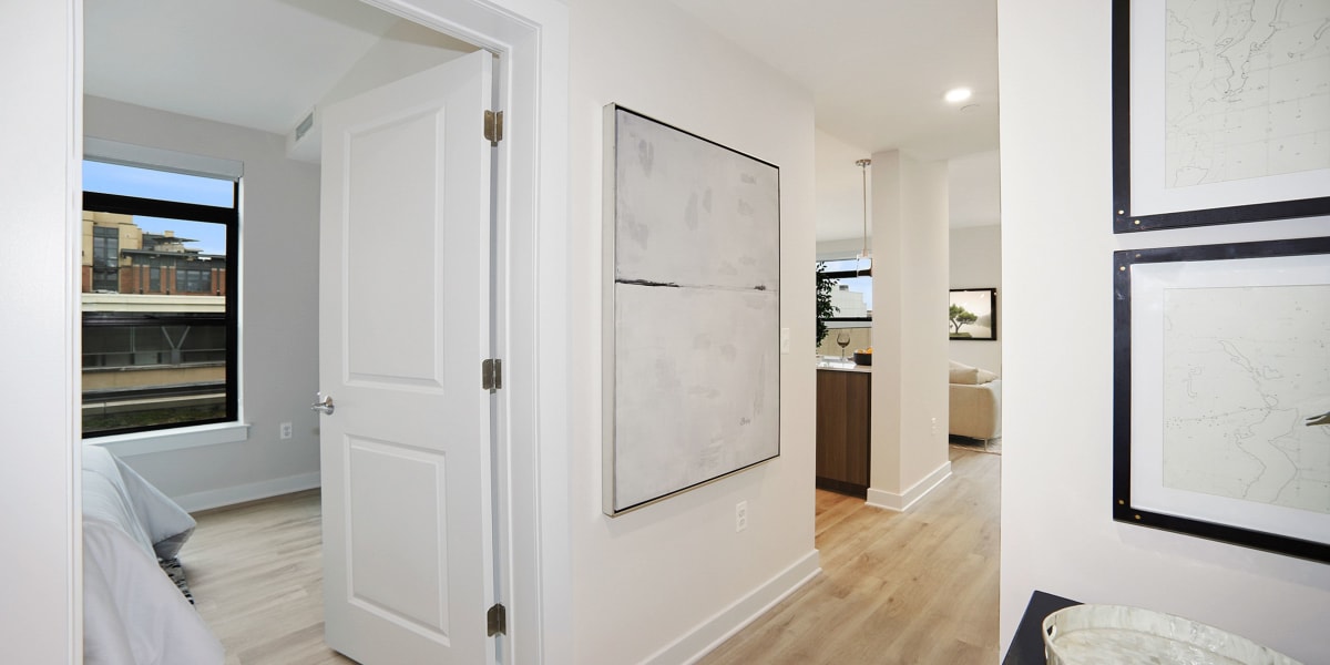 Spacious hallway from the living room to the bedrooms at Madrona Apartments in Washington, District of Columbia