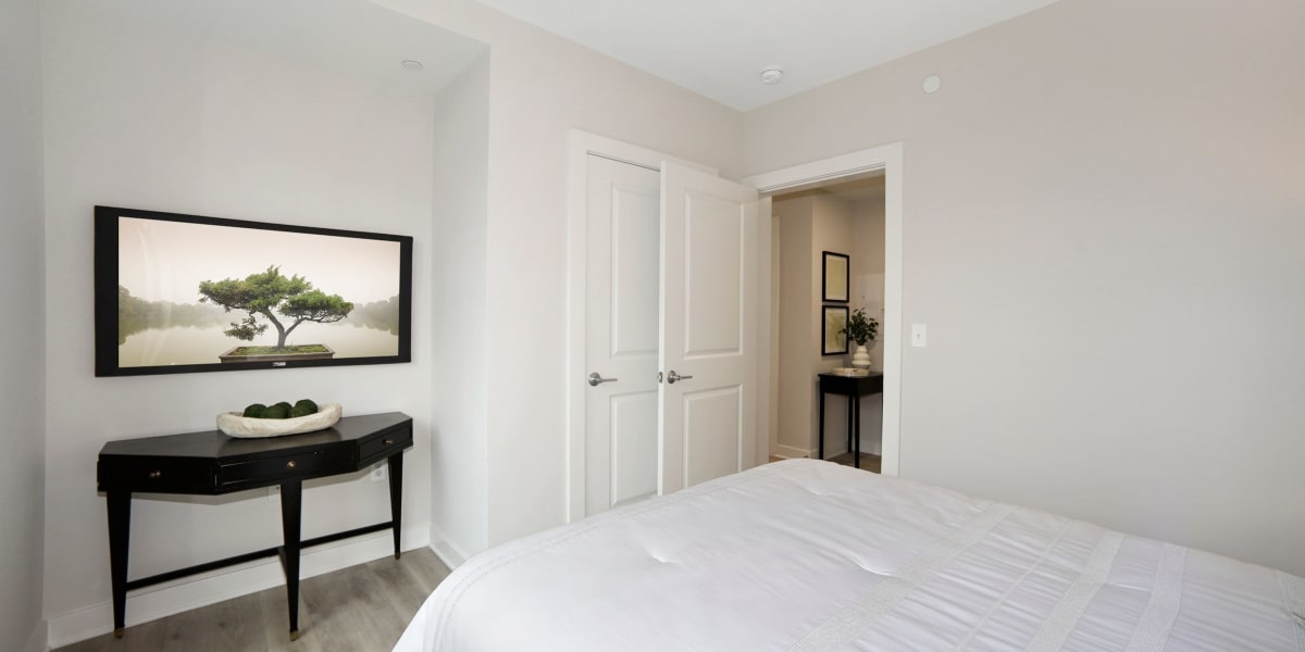 Modern and minimal bedroom in a model home at Madrona Apartments in Washington, District of Columbia 