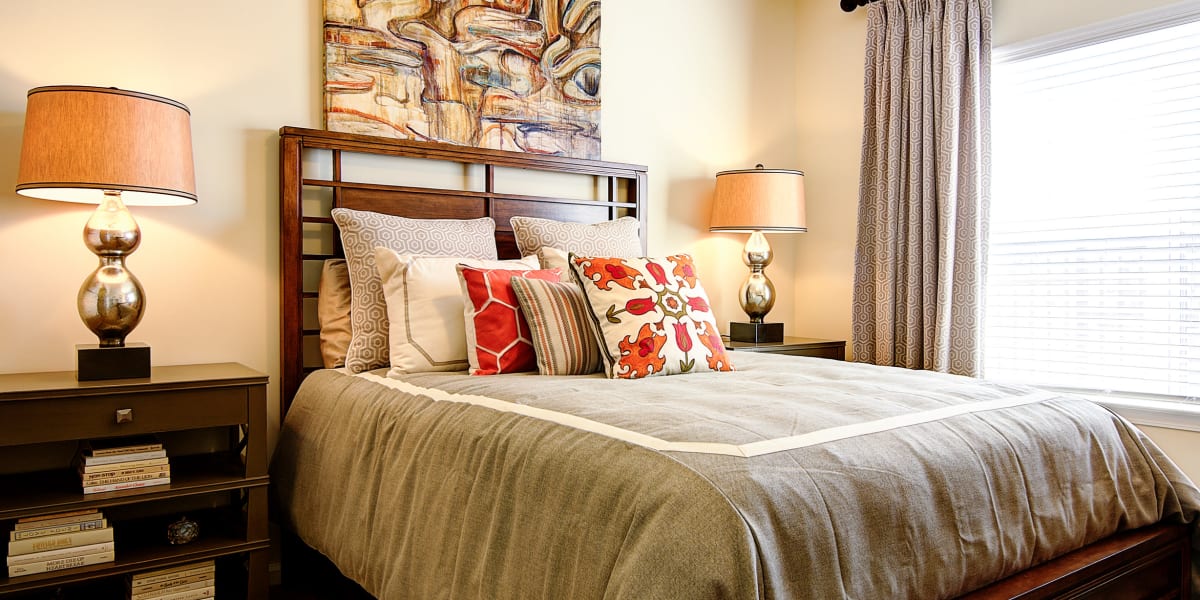 Well decorated bedroom with large windows at The Retreat at Market Square in Frederick, Maryland