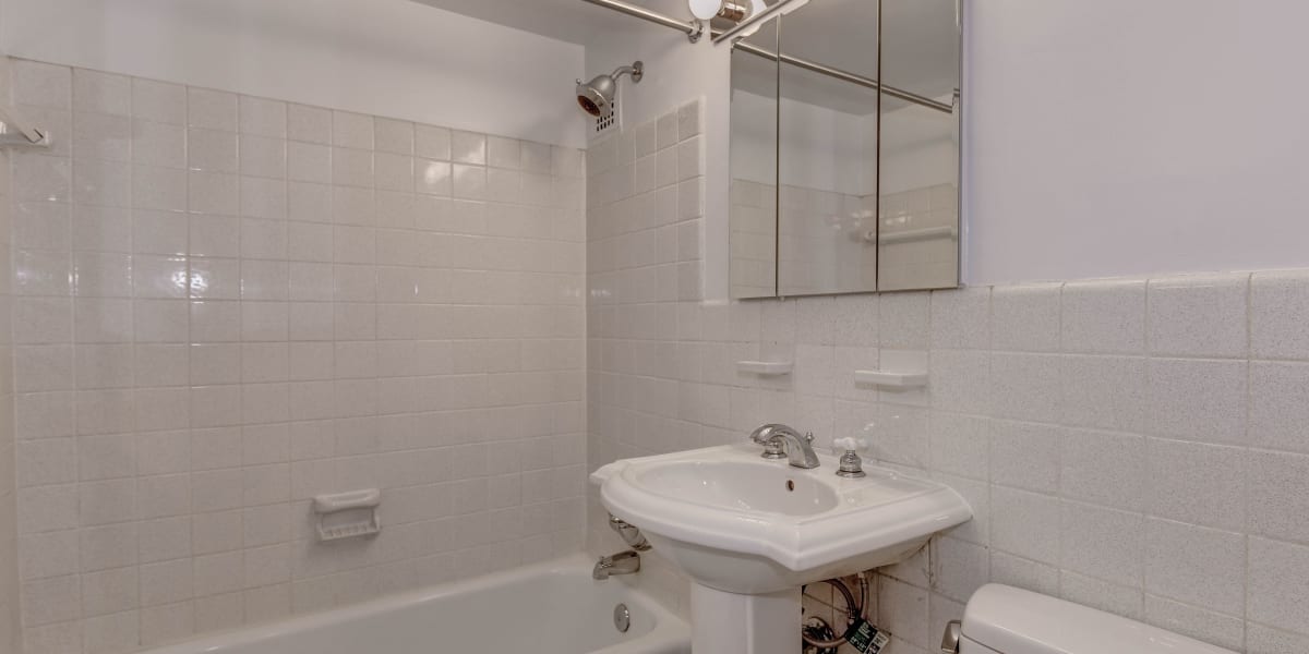 Shower and bathtub in the bathroom next to the cute vanity at Hill House in Washington, District of Columbia