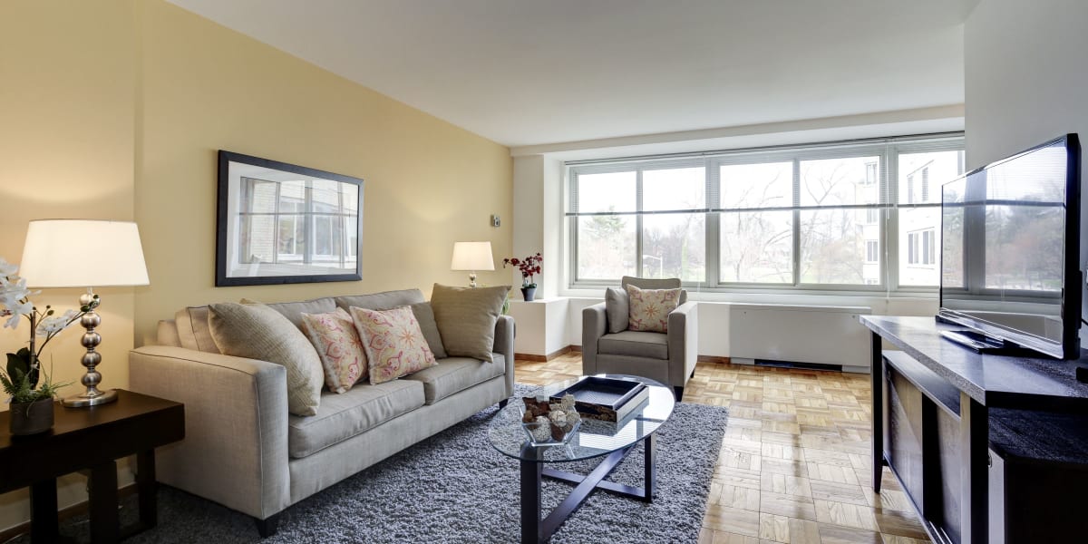Spacious living room with large windows and lots of light at The Brandywine Apartments in Washington, District of Columbia