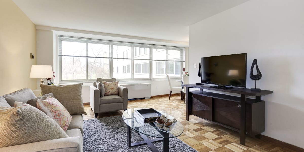 Large living room with hardwood style flooring at The Brandywine Apartments in Washington, District of Columbia