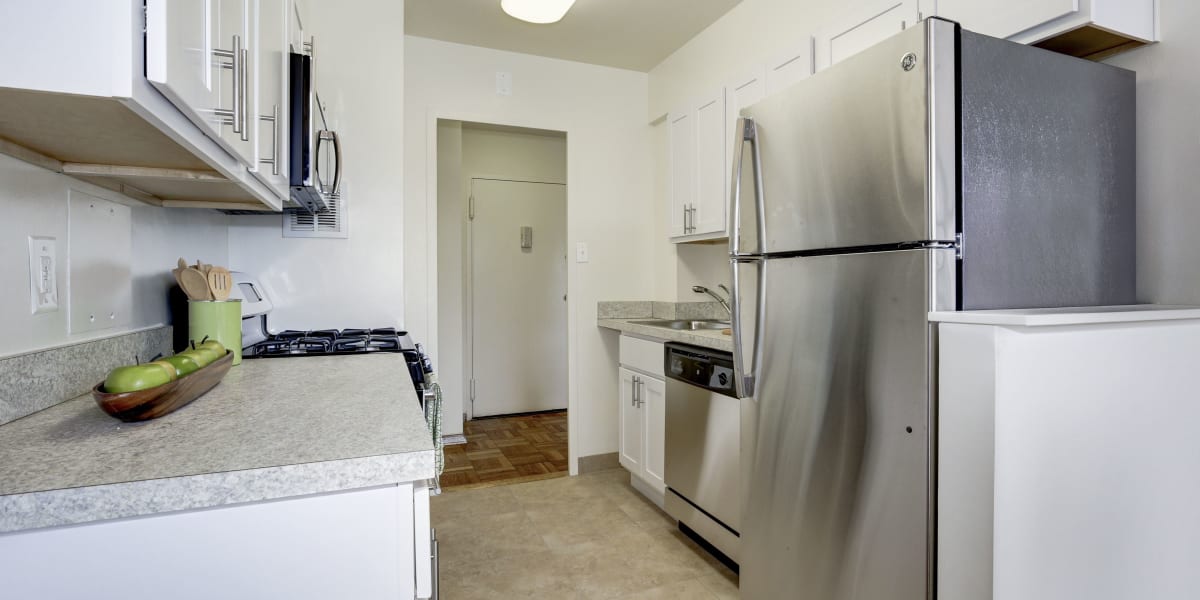Stainless steal appliances in the model home's kitchen area at The Brandywine Apartments in Washington, District of Columbia