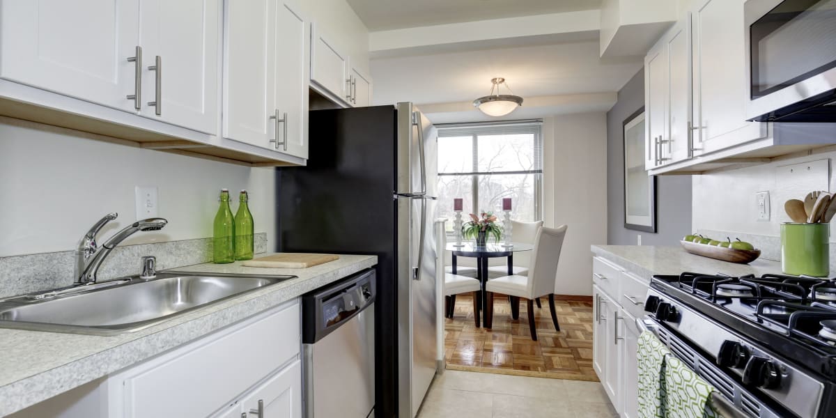 White cabinets with lots of counter space in the kitchen at The Brandywine Apartments in Washington, District of Columbia