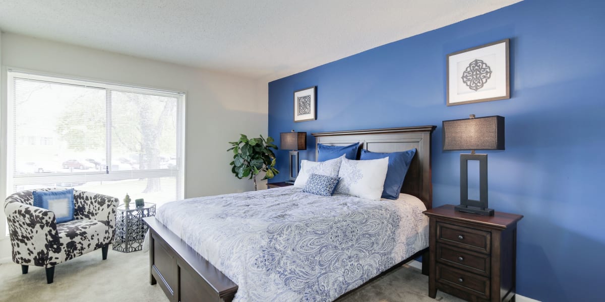 Very spacious bedroom with a nice blue wall in a model home at The Brinkley House in Temple Hills, Maryland