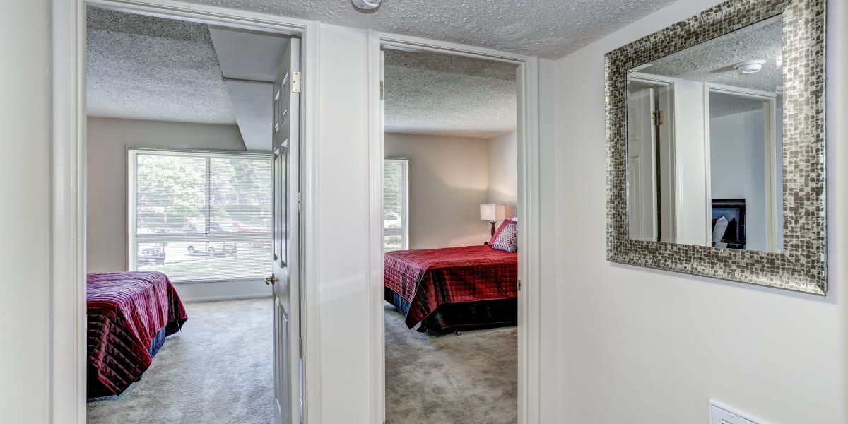 Hallway to the bedroom with large mirrors at The Brinkley House in Temple Hills, Maryland