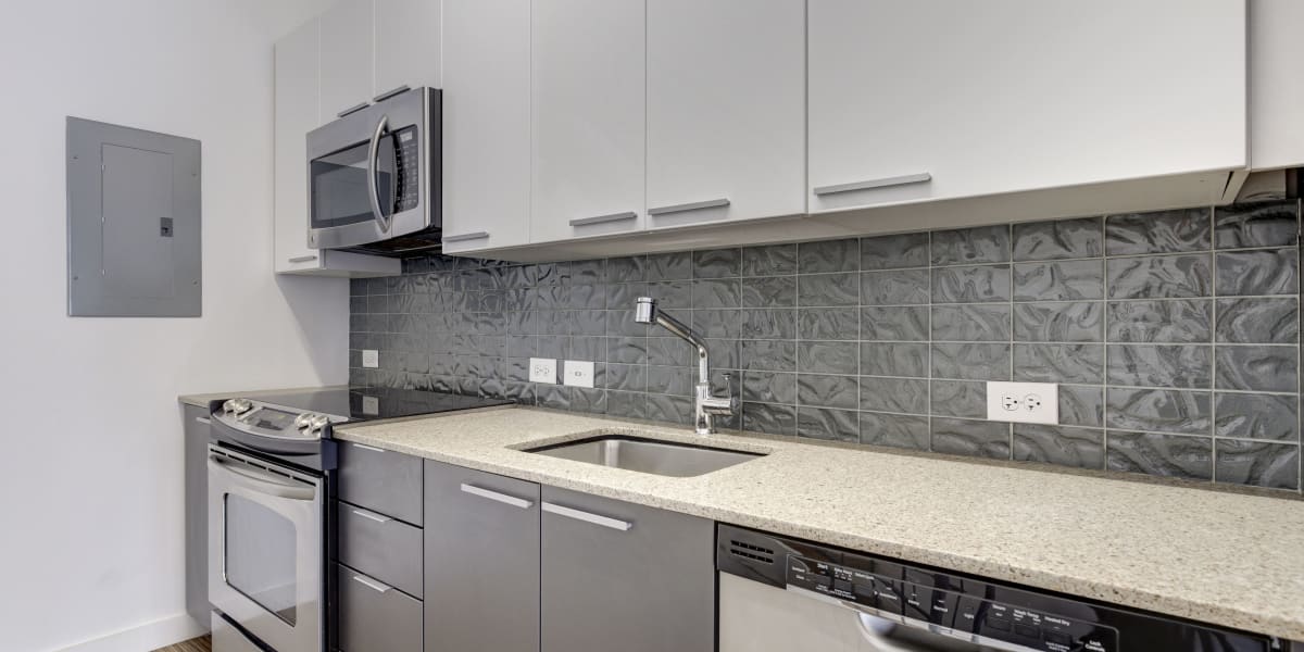 Tons of counter space in the modern kitchen with stainless steel appliances at The Citadel in Washington, District of Columbia