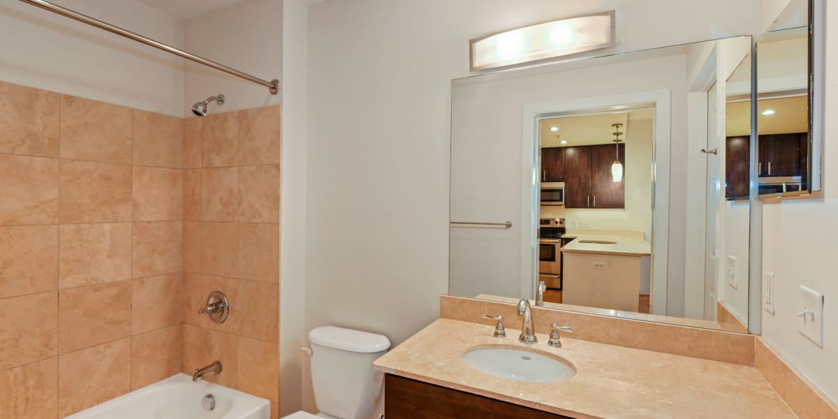 Lots of counter space in the bathroom and a large mirror above the vanity at Griffin Apartments in Washington, District of Columbia