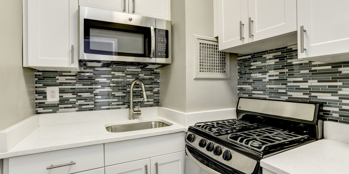 Gorgeous backsplash in the kitchen behind the nice stainless steel appliances at The Croydon in Washington, District of Columbia