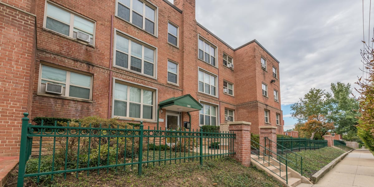 Large brick building with lots of homes ready for you to move into at Michigan Park Commons in Washington, District of Columbia