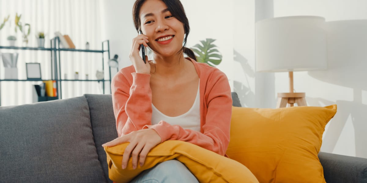 A woman on the phone at home near A-AAAKey - Redland in San Antonio, Texas