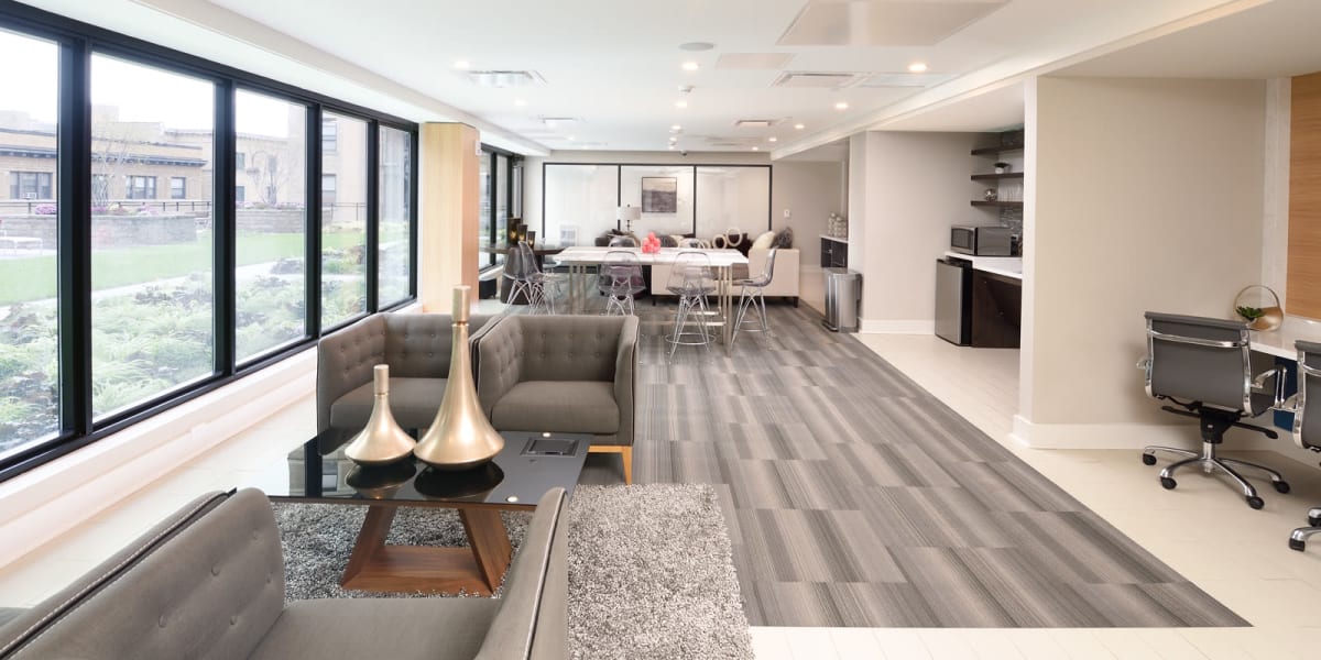 Spacious resident lounge with amazing views from the large windows at The Main in Evanston, Illinois
