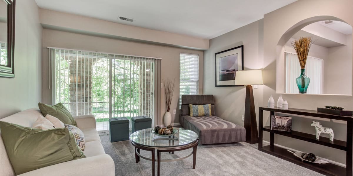 Living room with plenty of modern details at The Residences at Waterstone in Pikesville, Maryland