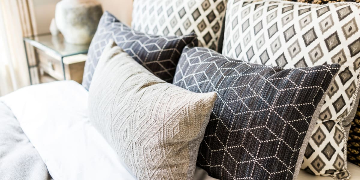 Pillows on a bed at The Carter in Grapevine, Texas