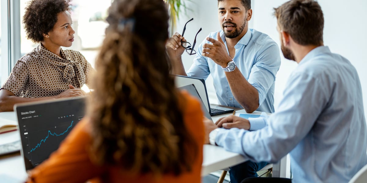 Coworkers in a meeting at Owner's Management Company in Bedford Heights, Ohio