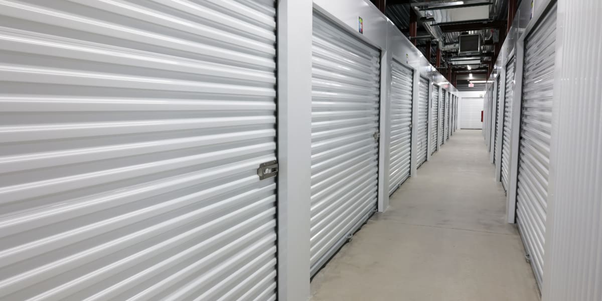 A row of indoor storage units at Avid Storage in Niceville, Florida