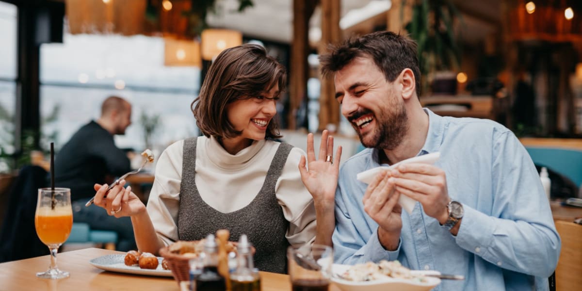 Happy couple at restaurant near Marquis Seven Meadows in Katy, Texas