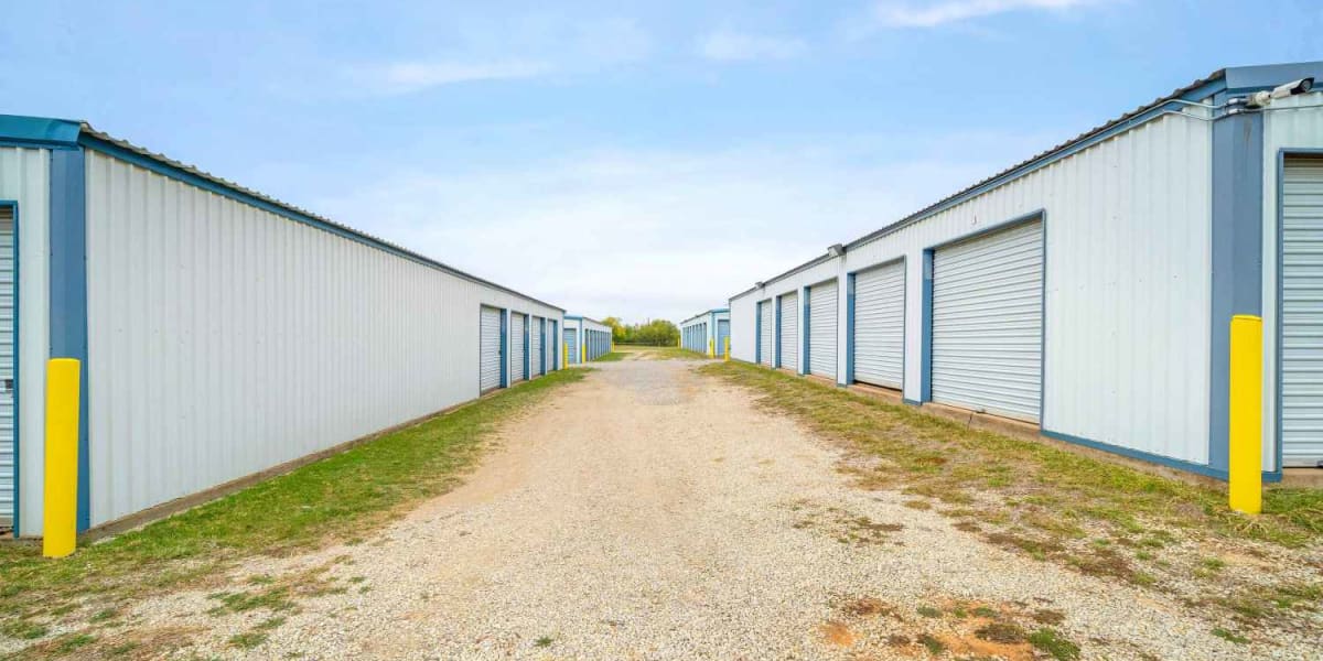 Outdoor storage units with wide driveways at StoreLine Self Storage in Wichita Falls, Texas