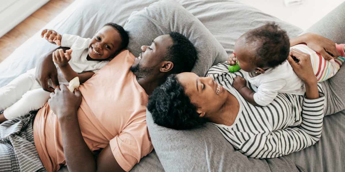 Family relaxing in their new home at Mountain View in Culpeper, Virginia