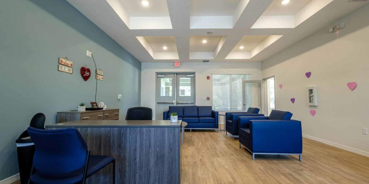Community indoor lounge with seating at Gannet Point in Kissimmee, Florida
