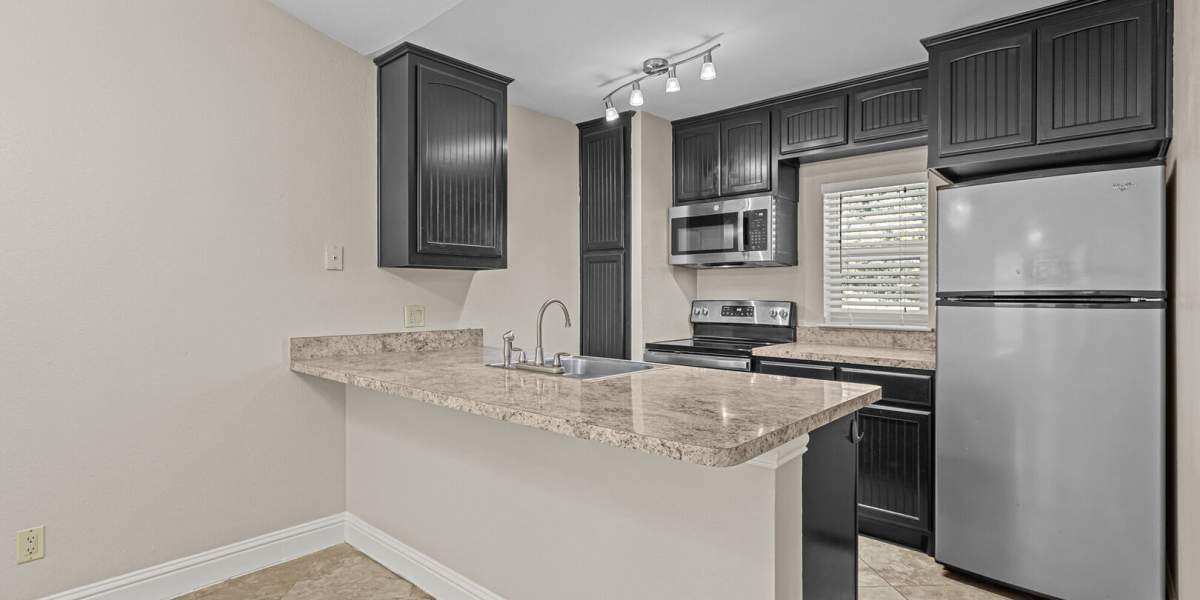 kitchen with stainless steel finishes at Courtyard Apartments And Storage in Granbury, Texas