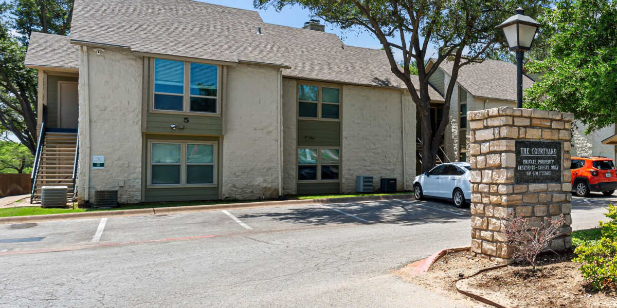 signage outside at Courtyard Apartments And Storage in Granbury, Texas