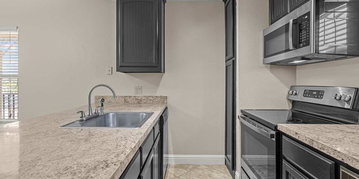 hallway kitchen at Courtyard Apartments And Storage in Granbury, Texas