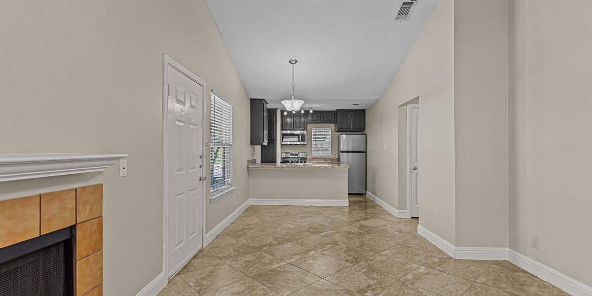 living room and kitchen at Courtyard Apartments And Storage in Granbury, Texas