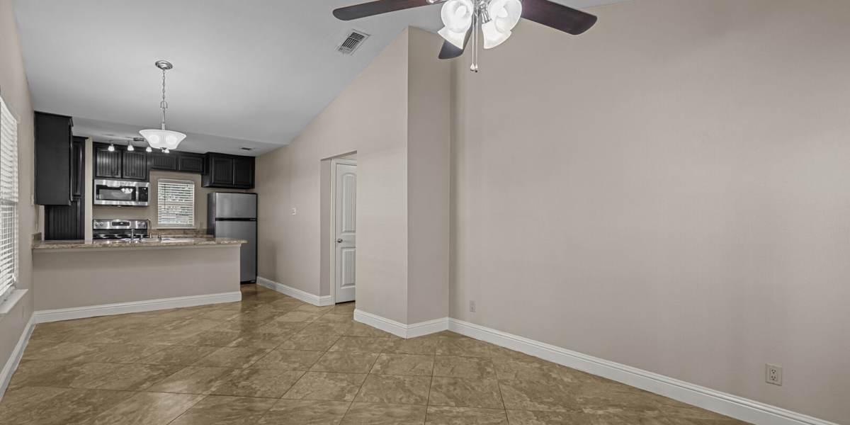 living room and kitchen angle 2 at Courtyard Apartments And Storage in Granbury, Texas
