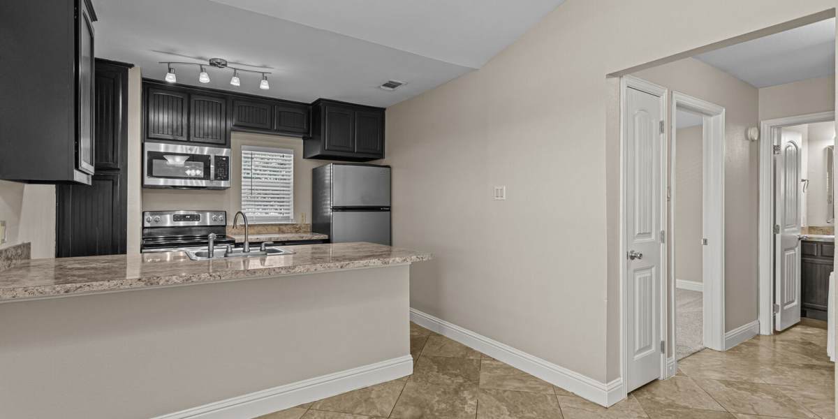 Kitchen and bedroom hallway at Courtyard Apartments And Storage in Granbury, Texas