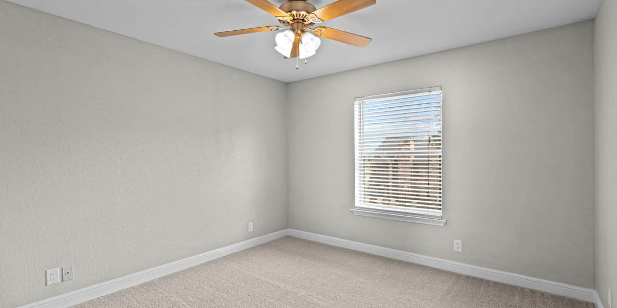 carpeted bedroom angle 2 Towne Lake Apartments in Granbury, Texas