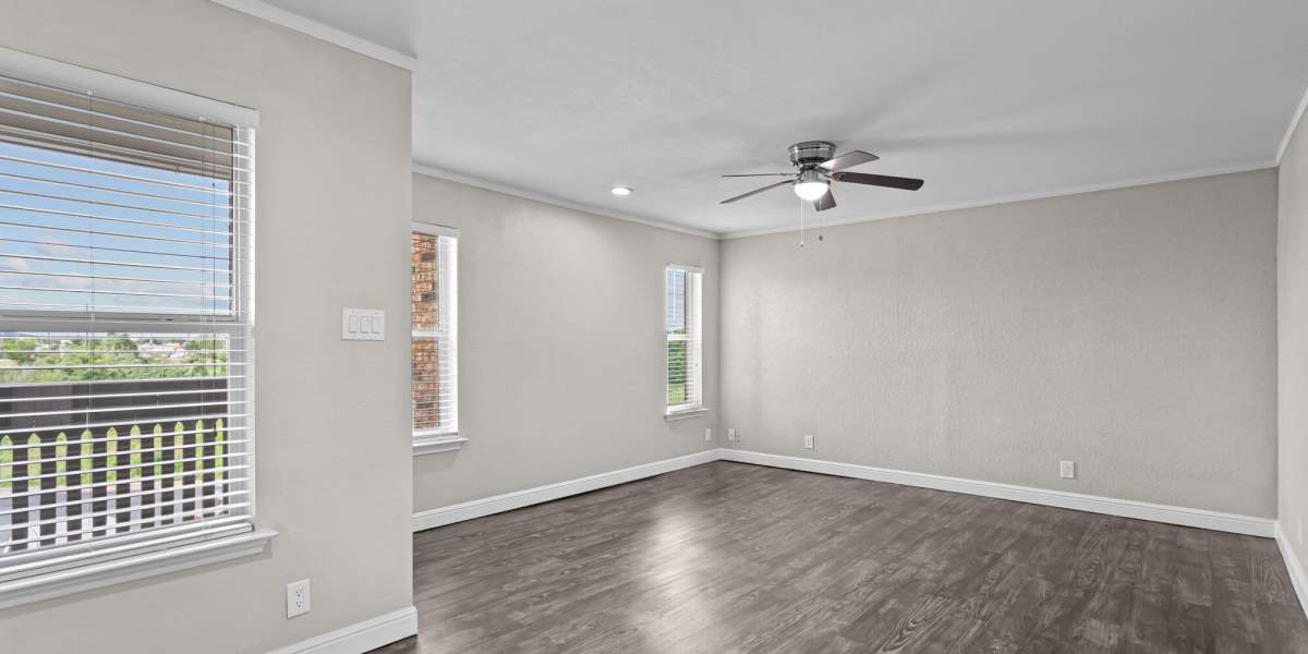 Empty living room angle 3 Towne Lake Apartments in Granbury, Texas