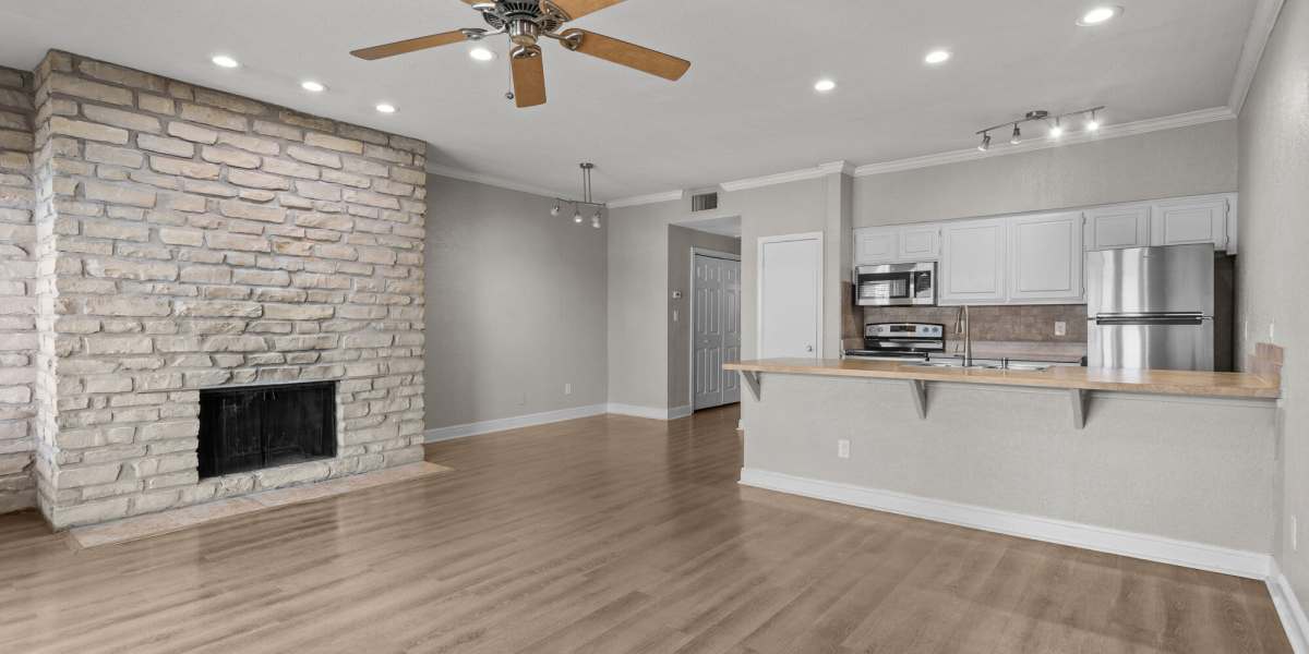 living room with a fireplace at Towne Square Condos at The Lodge in Granbury, Texas