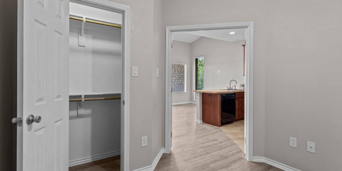 Hall closet and kitchen at Towne Square Condos at The Lodge in Granbury, Texas