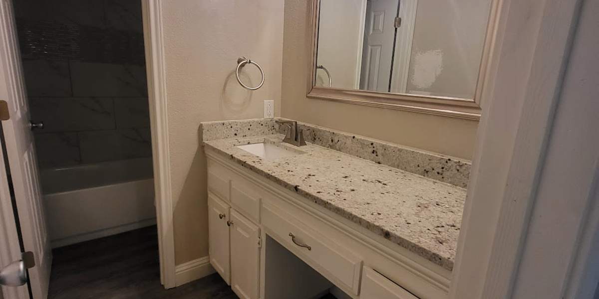Apartment bathroom at Towne Square Condos at The Lodge in Granbury, Texas