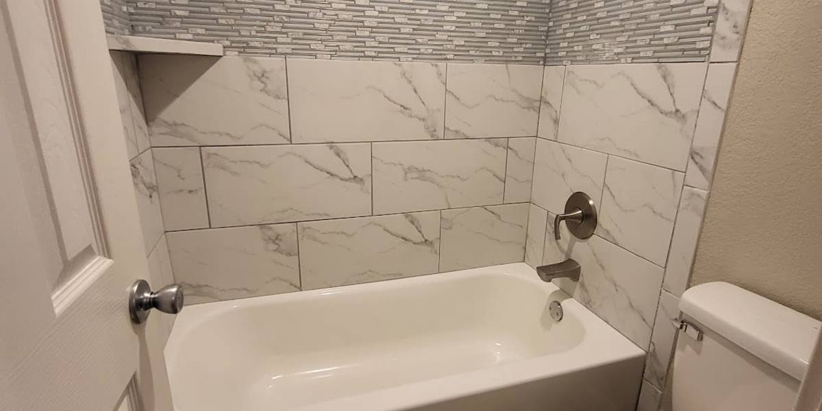 Tile backsplash in a bathroom at Towne Square Condos at The Lodge in Granbury, Texas