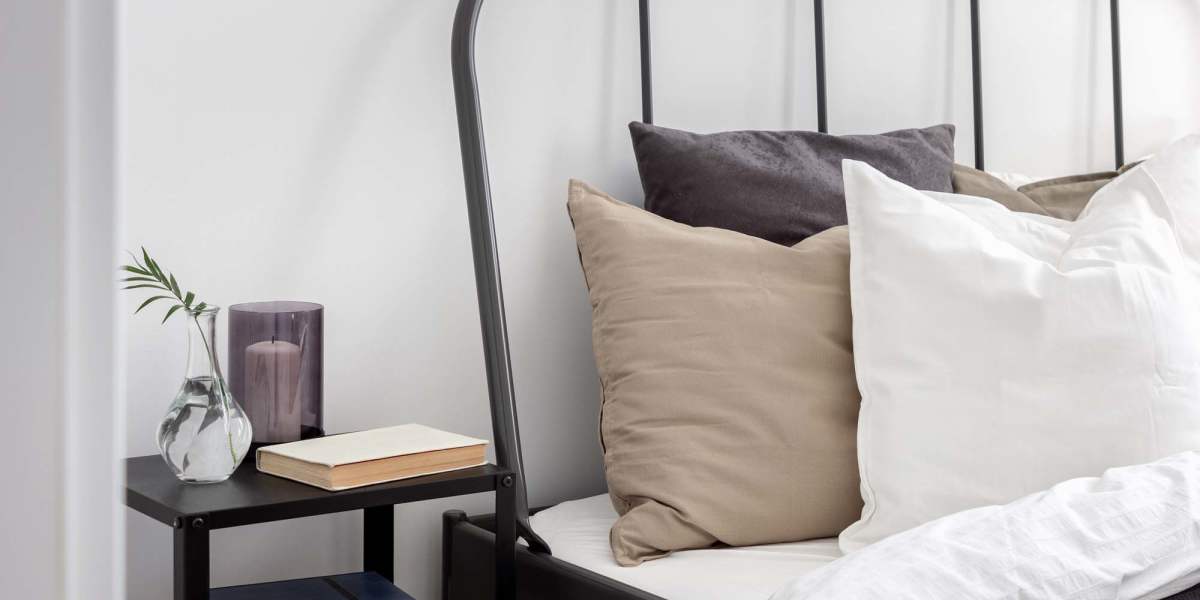 bedroom with sidetable  at Parc at Rosenwald in Griffin, Georgia      